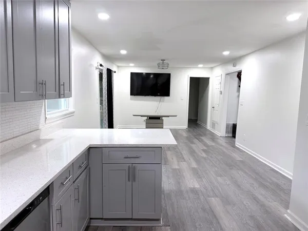 a kitchen with a sink and refrigerator