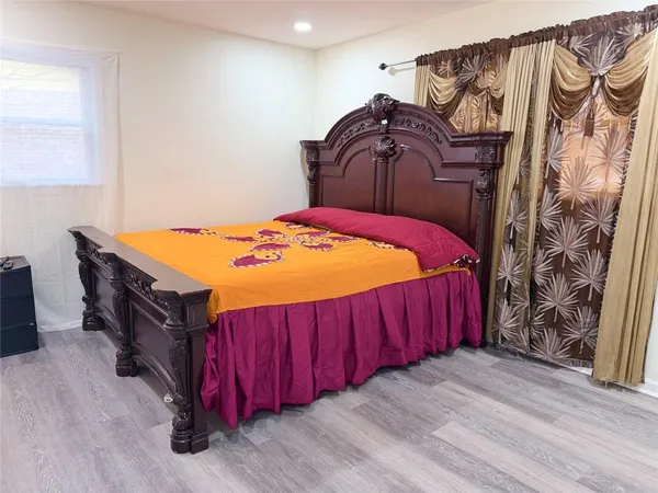 a bedroom with a bed and a closet