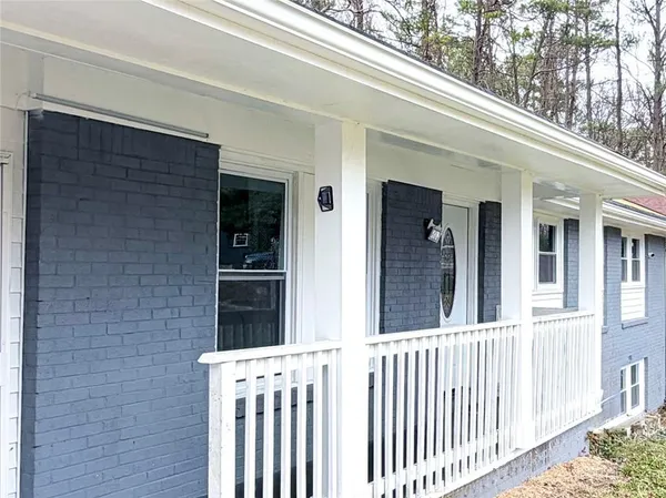 a view of a house with a small yard
