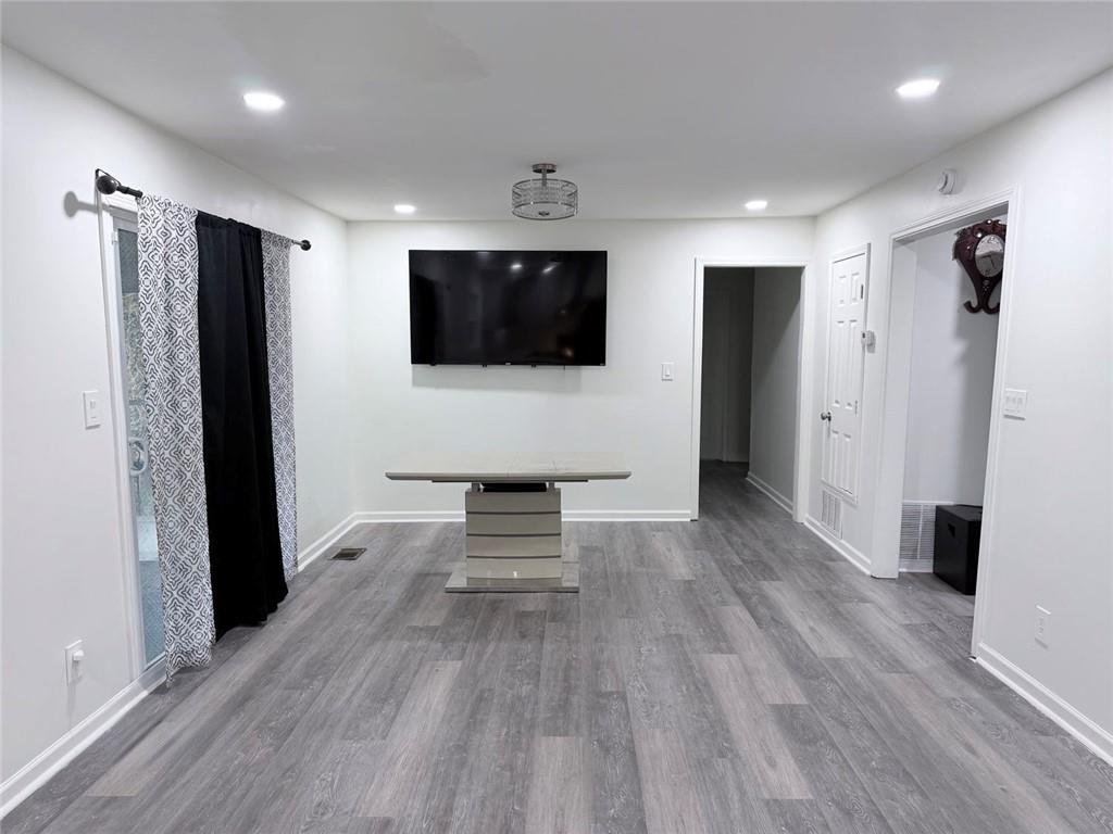 3878 Nielsen Court Clarkston, GA 30021 - Photo 8 of 26 a living room with furniture and a flat screen tv