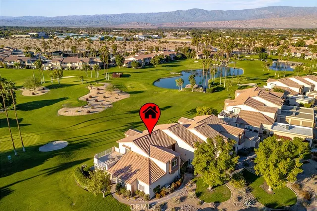 an aerial view of a houses with a lake view