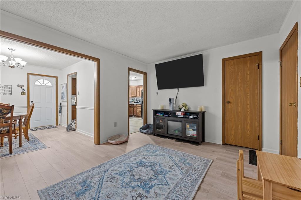 2036 Willow Road Greensboro, NC 27406 - Photo 12 of 19 Living Area complet with a storage closet and large storage room on the side.