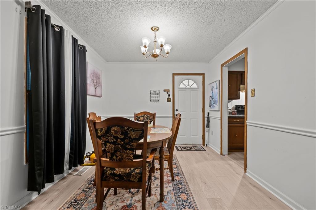 2036 Willow Road Greensboro, NC 27406 - Photo 14 of 19 Enter your new home and get right to your large open kitchen and dining space!