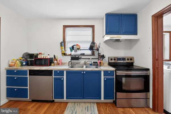 a kitchen with a stove and a cabinets