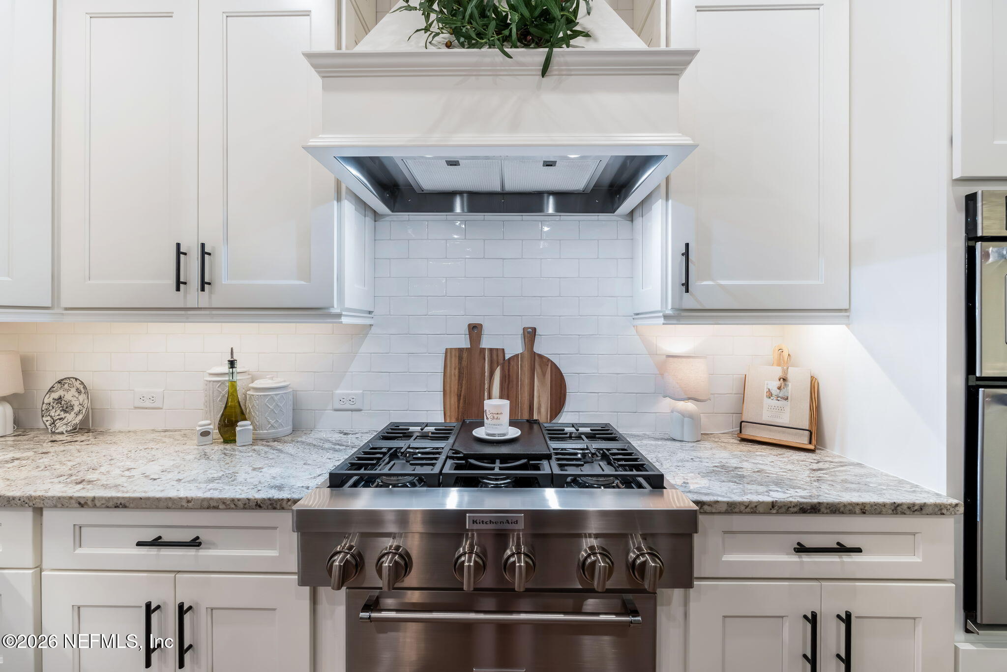 1204 Creek Bend Road St. Johns, FL 32259 - Photo 29 of 107 a stove top oven sitting inside of a kitchen