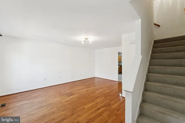 a view of an empty room with stairs