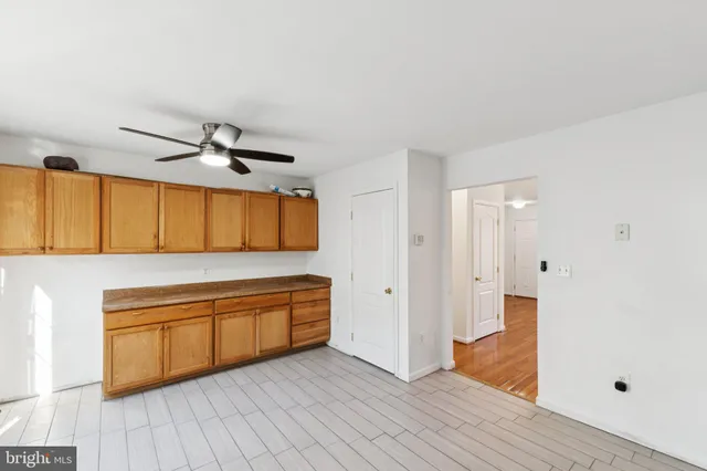a kitchen with wooden floors and a sink