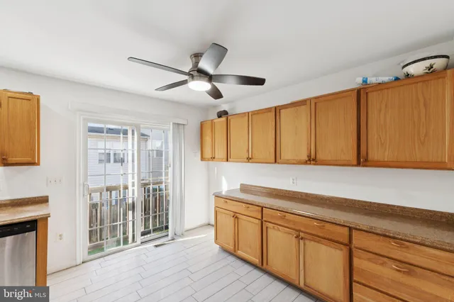 a kitchen with cabinets a sink and appliances