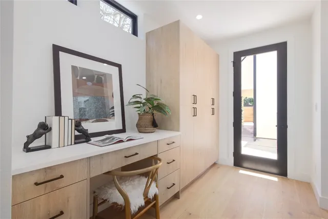 a bathroom with a sink a mirror and a window