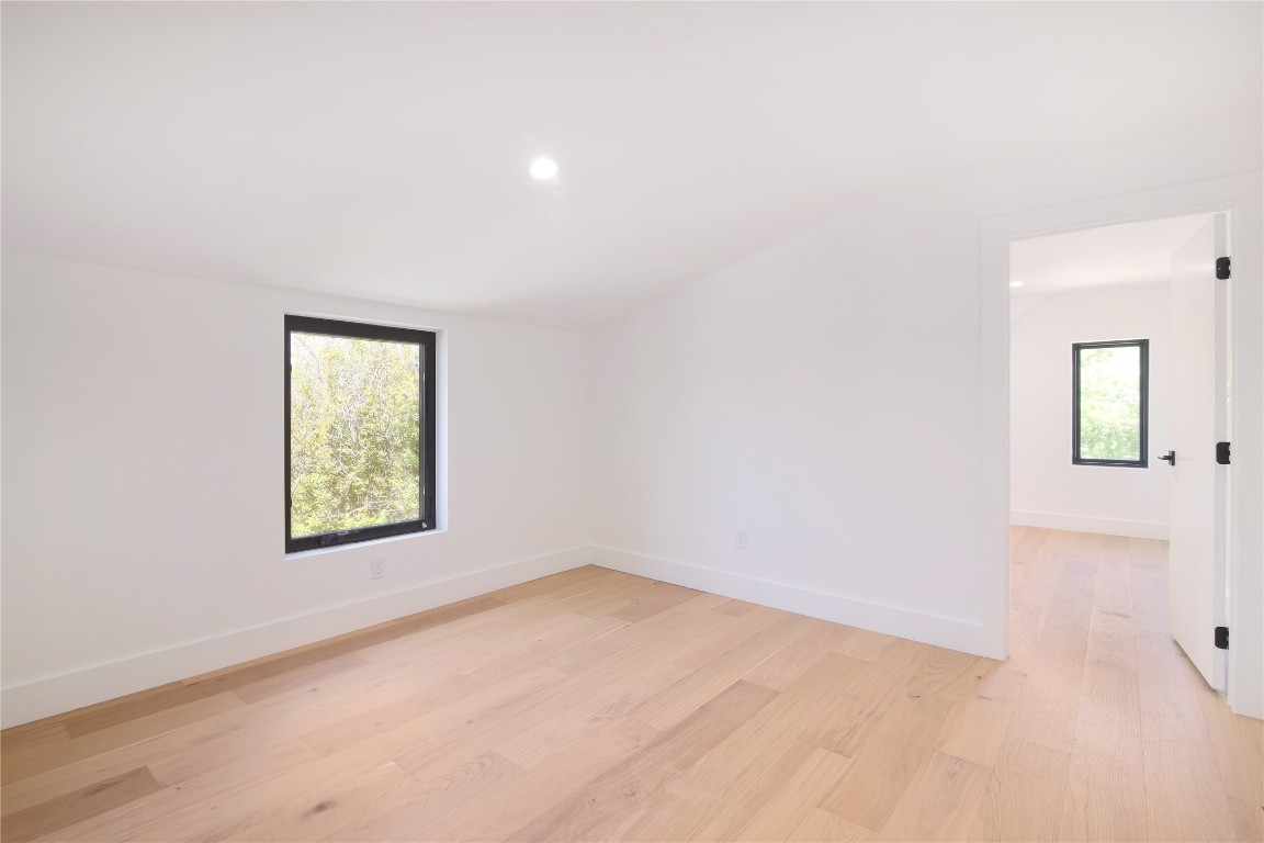 2401 Willow Street Austin, TX 78702 - Photo 24 of 38 an empty room with windows and closet