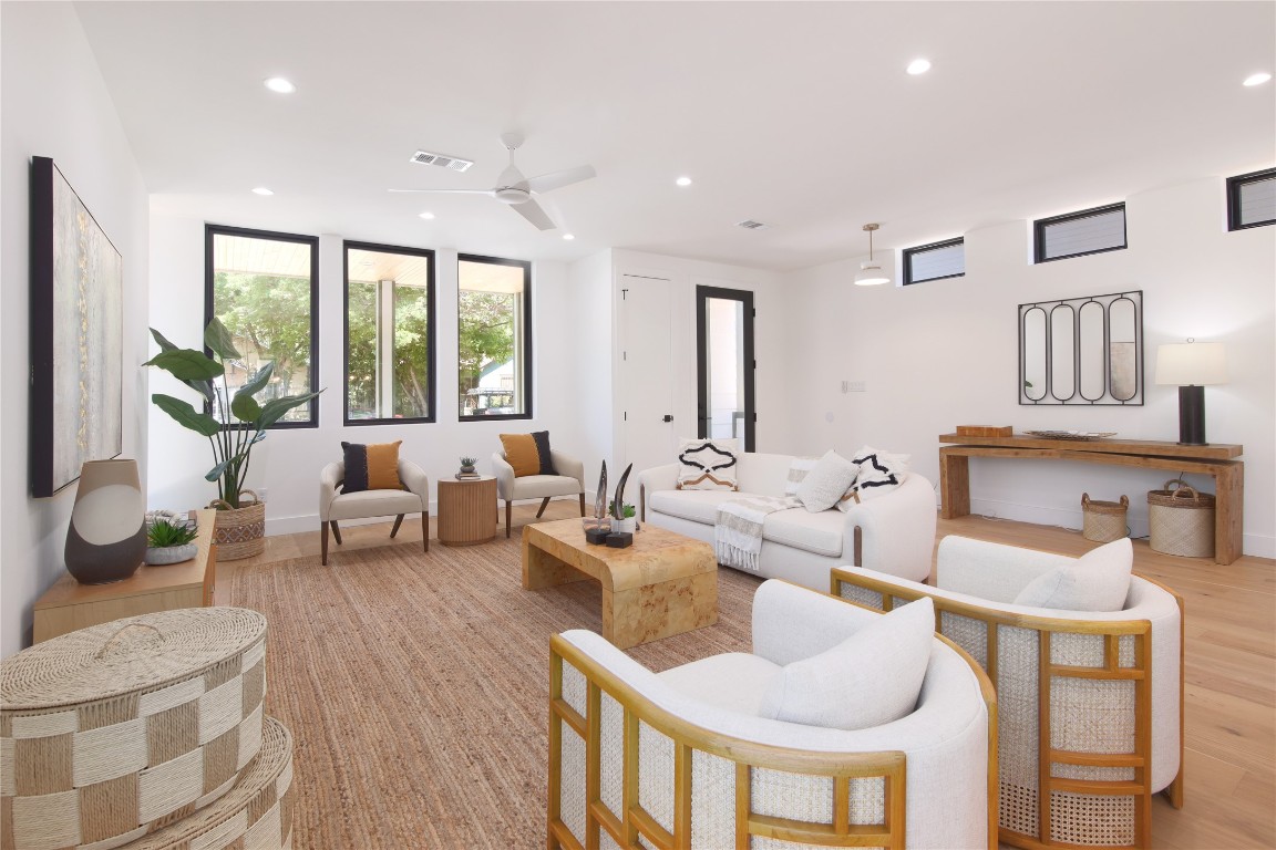 2401 Willow Street Austin, TX 78702 - Photo 8 of 38 a living room with furniture and a large window