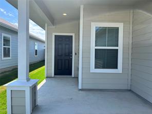 13309 Riding Drive Manor, TX 78653 - Photo 3 of 34 View of exterior entry featuring a patio