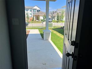 13309 Riding Drive Manor, TX 78653 - Photo 4 of 34 Doorway to outside with a residential view