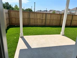 13309 Riding Drive Manor, TX 78653 - Photo 5 of 34 Fenced backyard with a patio