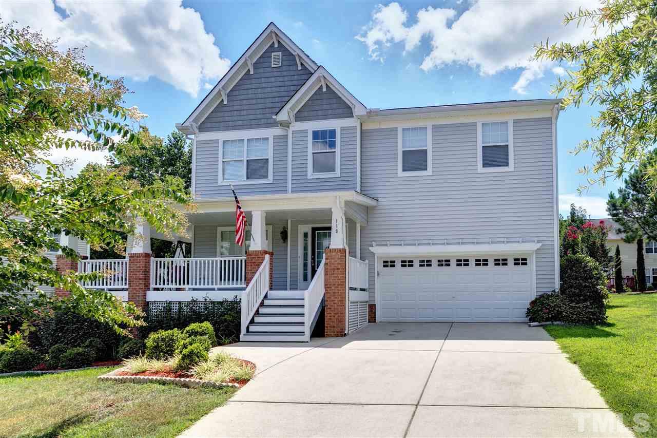 119 Key Biscayne Court Raleigh, NC 27603 - Photo 2 of 24 a front view of a house with a garden