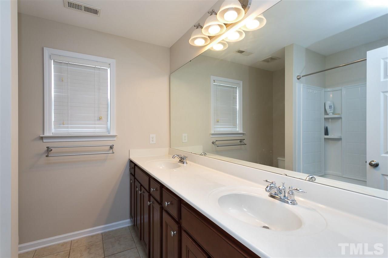 119 Key Biscayne Court Raleigh, NC 27603 - Photo 13 of 24 a bathroom with a sink vanity and a mirror