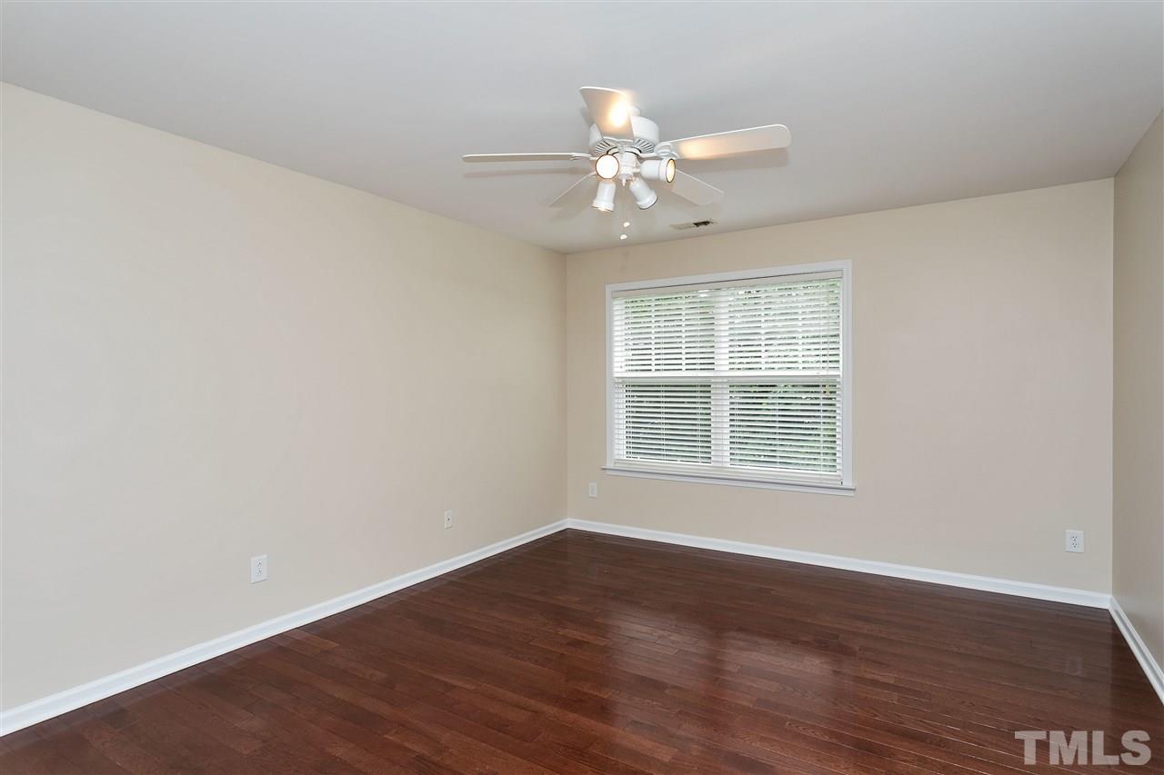119 Key Biscayne Court Raleigh, NC 27603 - Photo 14 of 24 a view of an empty room with wooden floor and a window