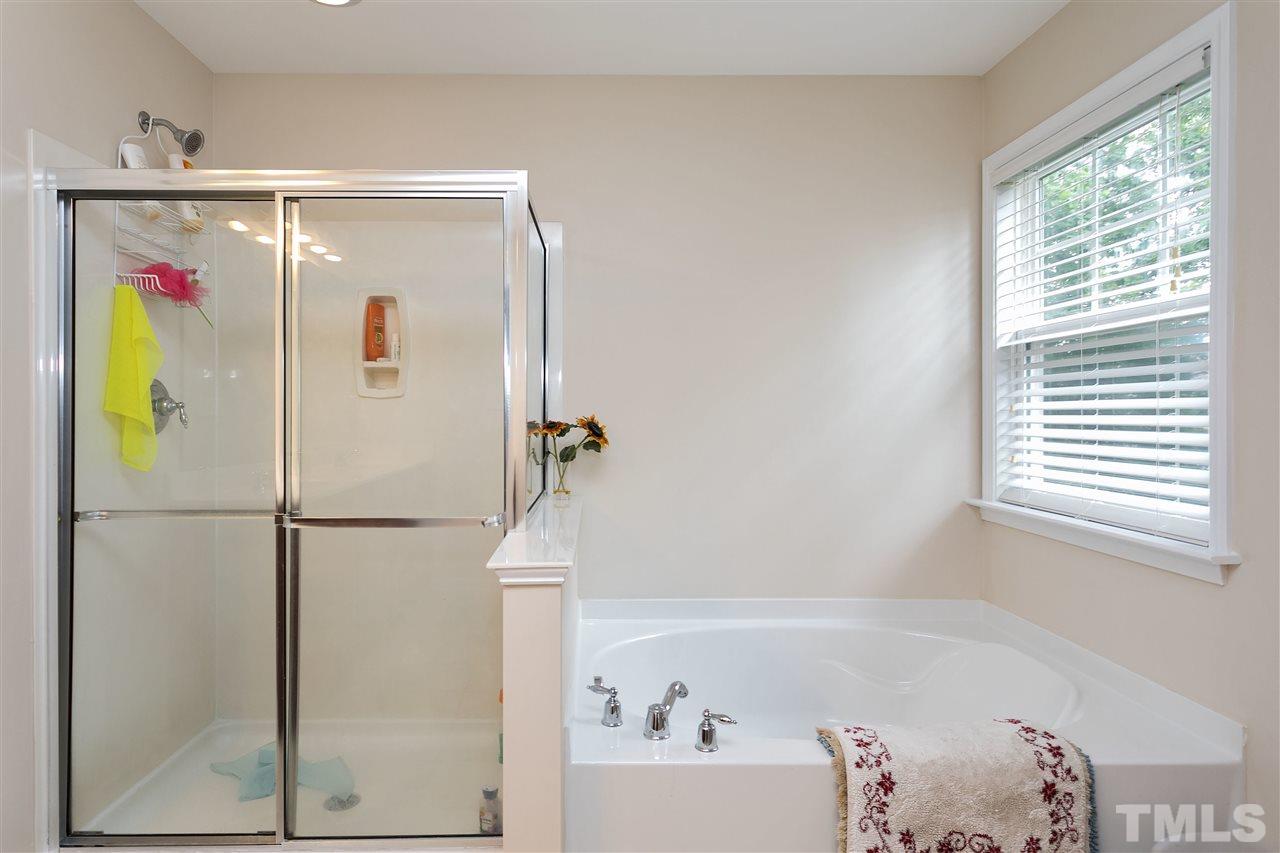 119 Key Biscayne Court Raleigh, NC 27603 - Photo 18 of 24 a bathroom with a bathtub and a shower