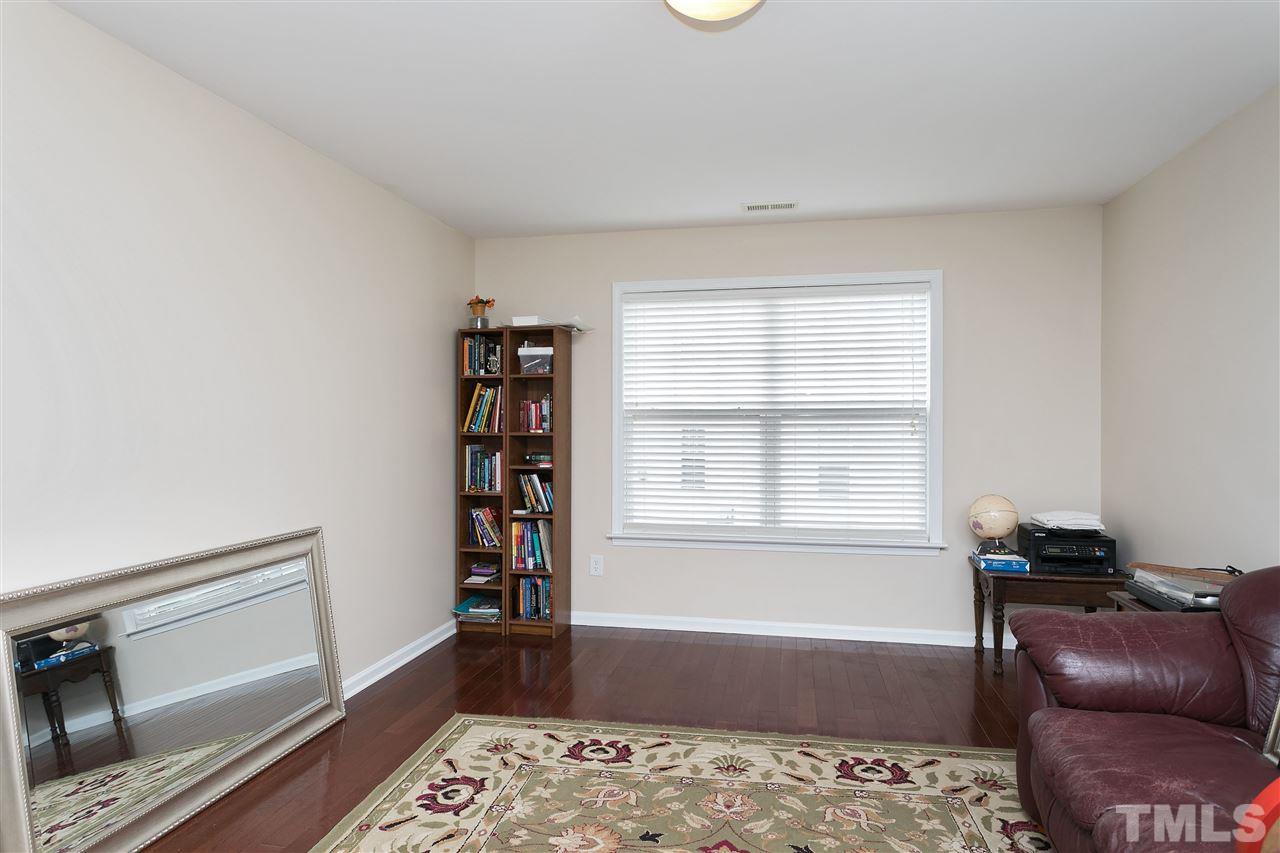 119 Key Biscayne Court Raleigh, NC 27603 - Photo 10 of 24 a bedroom with a bed and a window