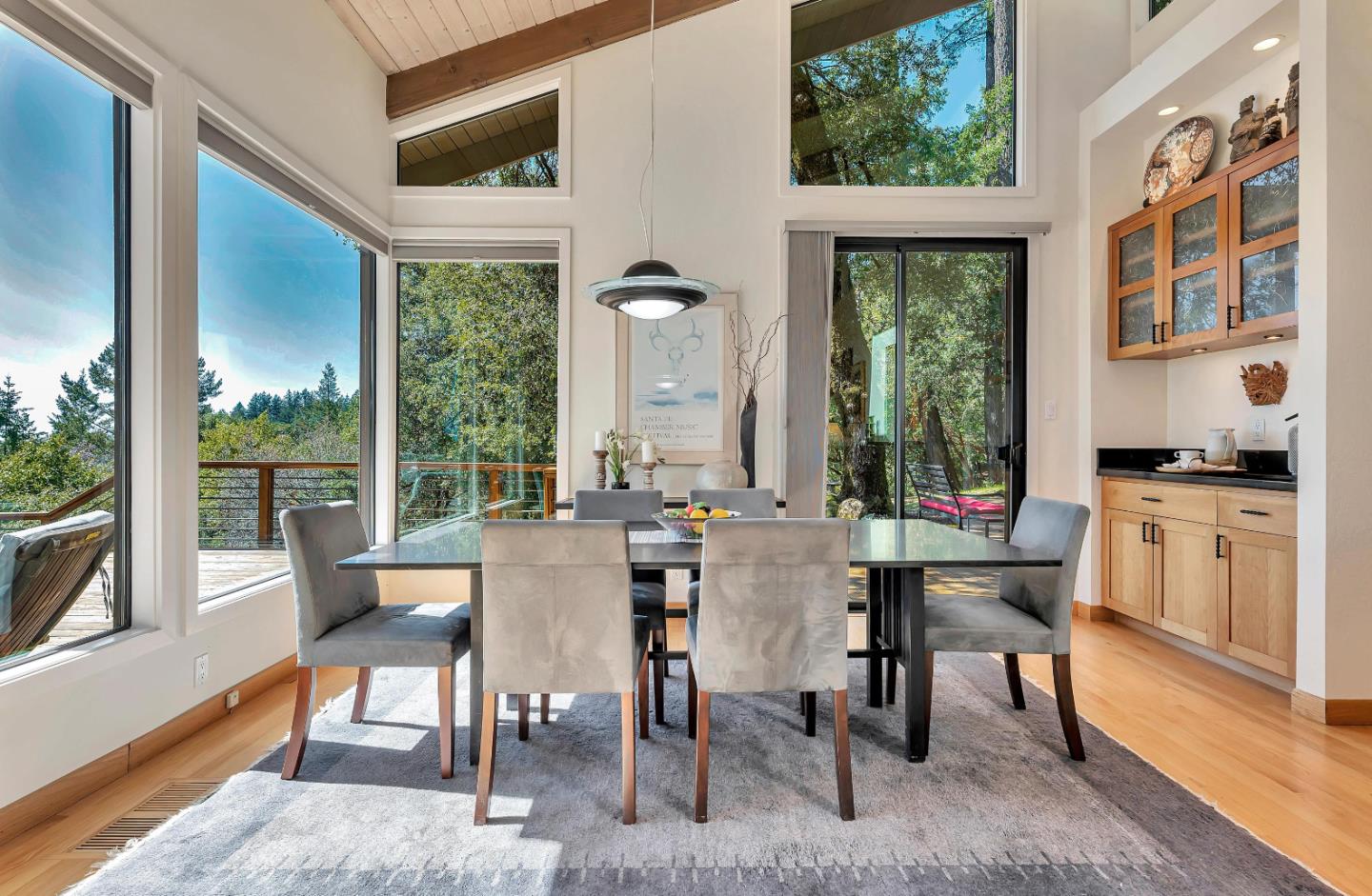 19170 Old Vineyard Road Los Gatos, CA 95033 - Photo 11 of 52 a view of a dining room with furniture large windows and wooden floor
