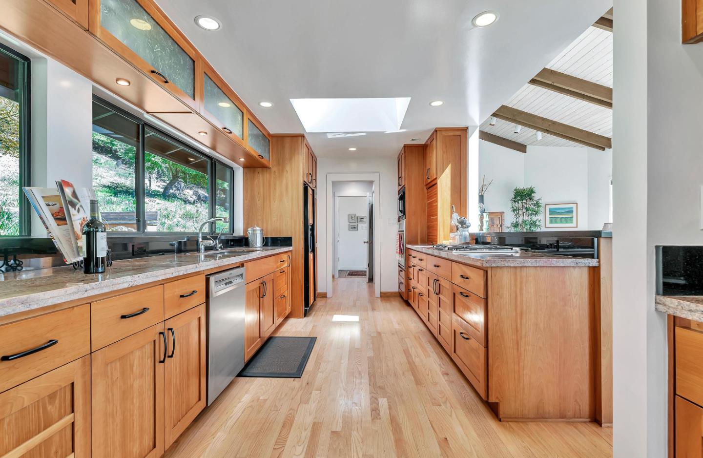 19170 Old Vineyard Road Los Gatos, CA 95033 - Photo 13 of 52 a large kitchen with stainless steel appliances a large counter top and a wooden floors