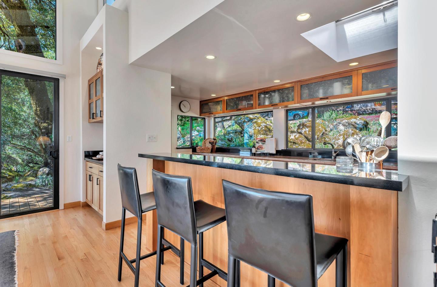 19170 Old Vineyard Road Los Gatos, CA 95033 - Photo 14 of 52 a dining room with stainless steel appliances granite countertop a table and chairs with wooden floor