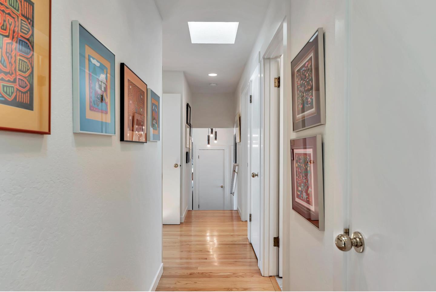 19170 Old Vineyard Road Los Gatos, CA 95033 - Photo 23 of 52 a view of a hallway with wooden floor and a bathroom