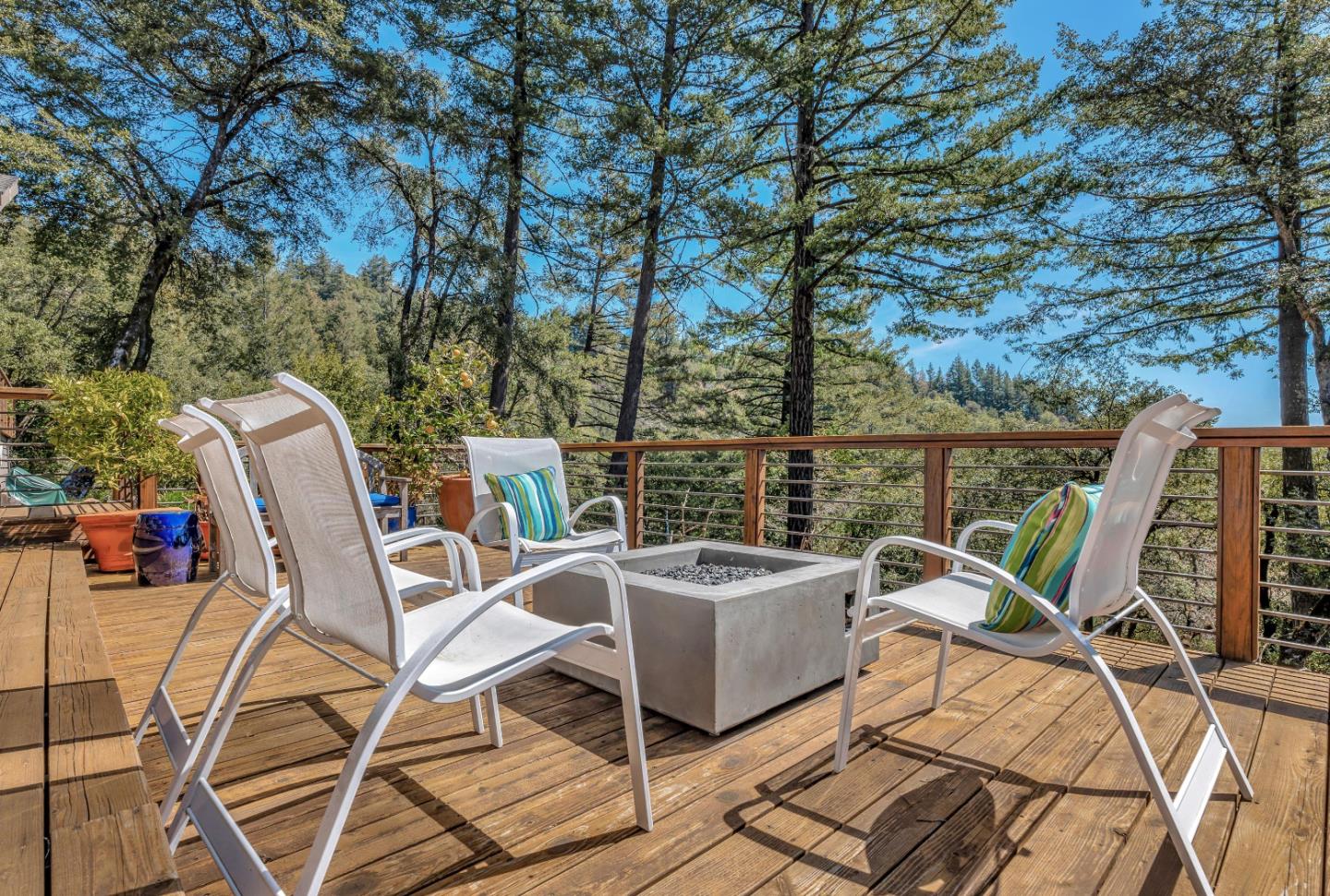 19170 Old Vineyard Road Los Gatos, CA 95033 - Photo 39 of 52 a view of a patio with table and chairs and wooden floor
