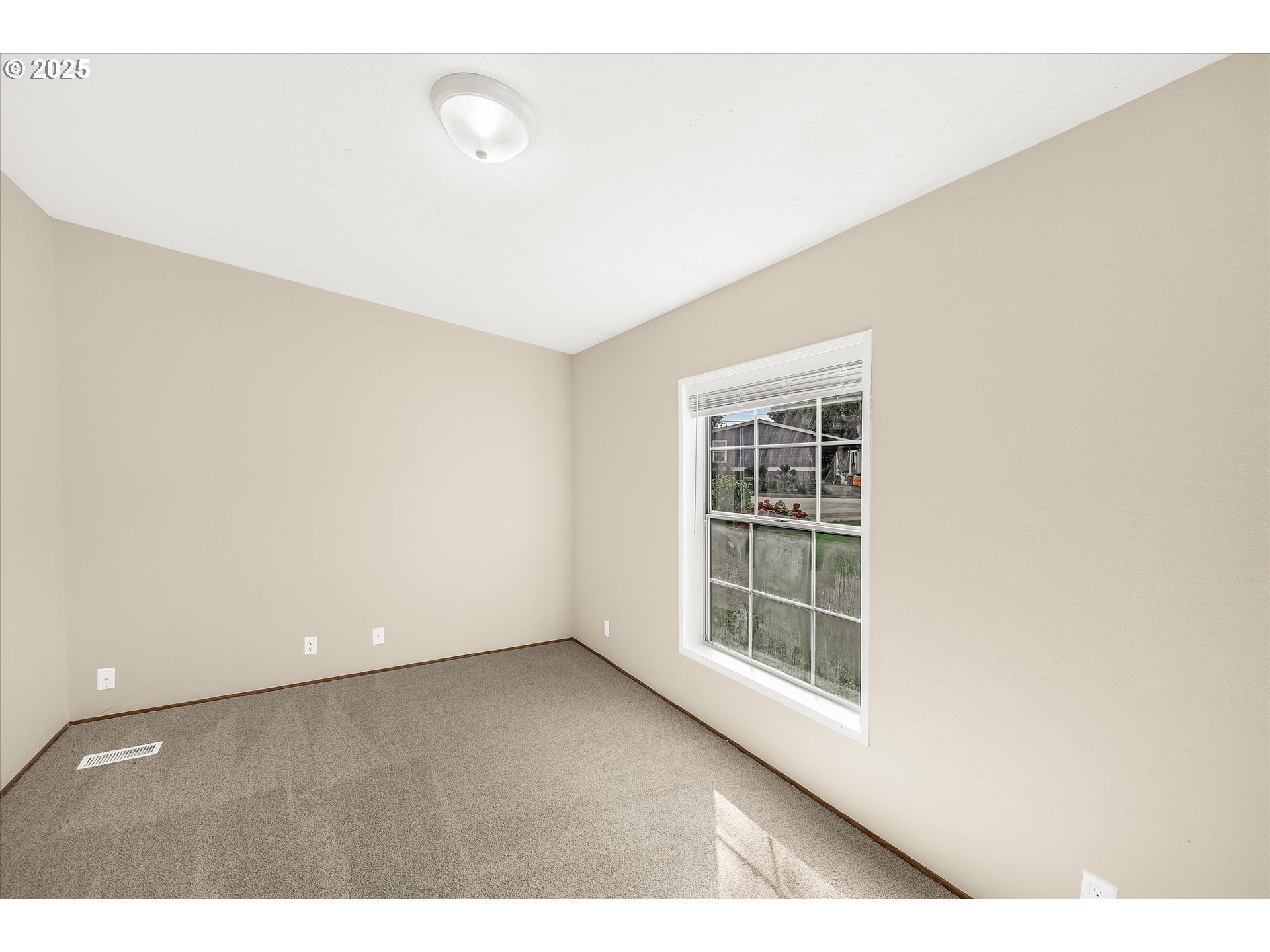 809 Southwest Crestview Way Troutdale, OR 97060 - Photo 23 of 40 a view of an empty room with a window