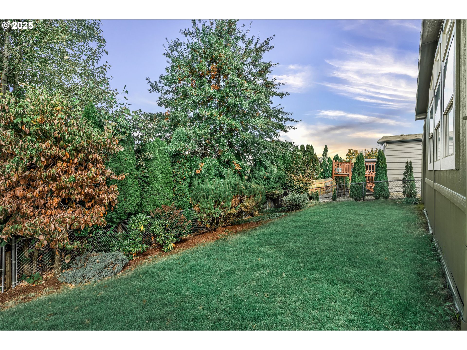 809 Southwest Crestview Way Troutdale, OR 97060 - Photo 7 of 40 a view of a backyard with garden