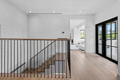 a view of a floor to ceiling window and a yard