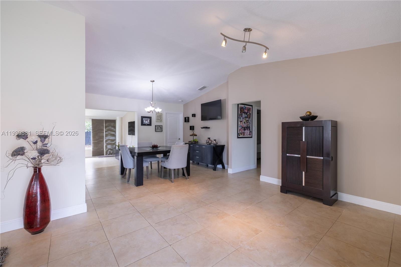 14766 Southwest 81st Street Miami, FL 33193 - Photo 12 of 39 a view of a room with furniture and chandelier