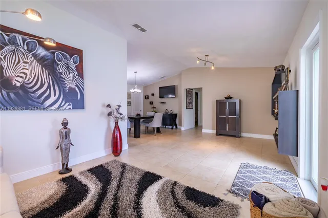 a view of a livingroom with furniture and a ceiling fan