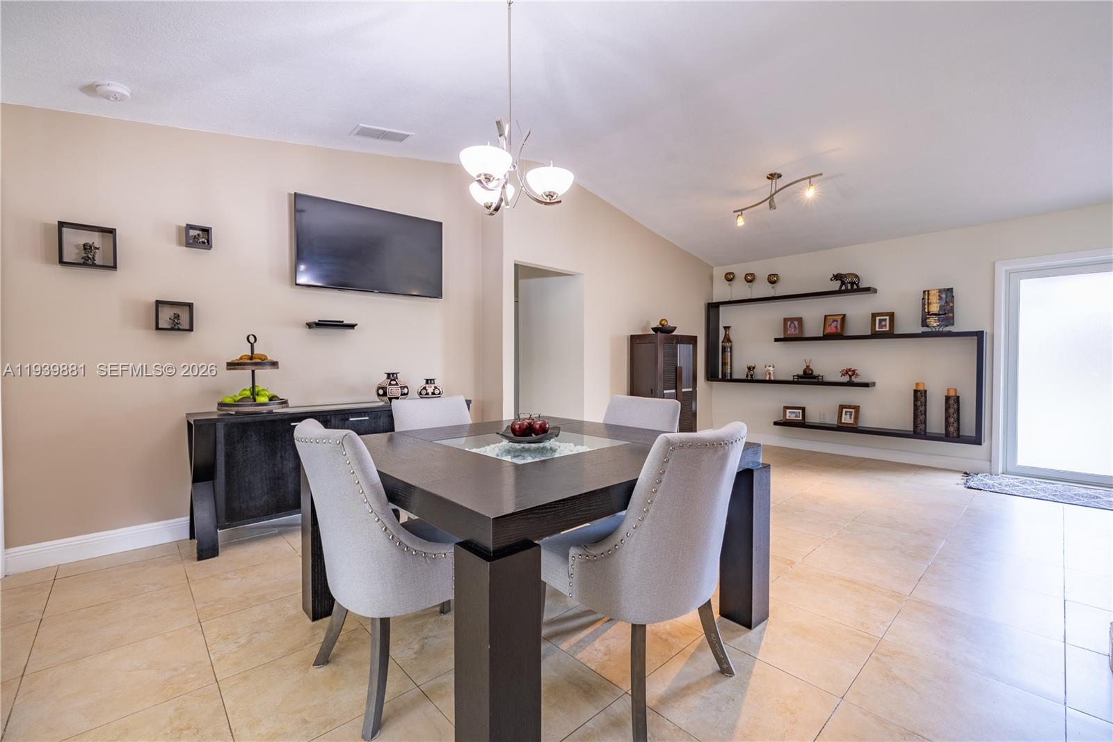 14766 Southwest 81st Street Miami, FL 33193 - Photo 14 of 39 a view of a dining room with furniture