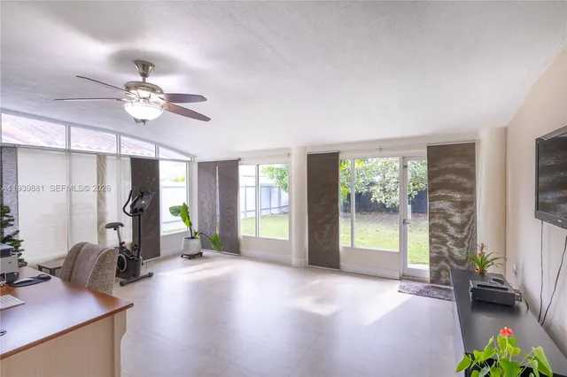 a view of a livingroom with furniture window and wooden floor