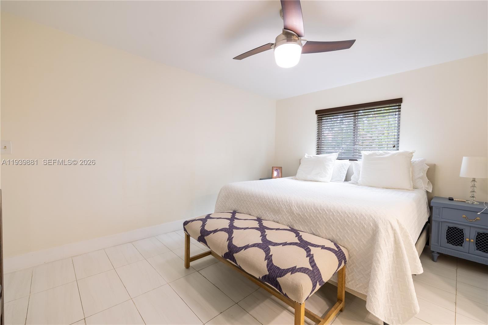 14766 Southwest 81st Street Miami, FL 33193 - Photo 19 of 39 a bedroom with a bed and a chandelier