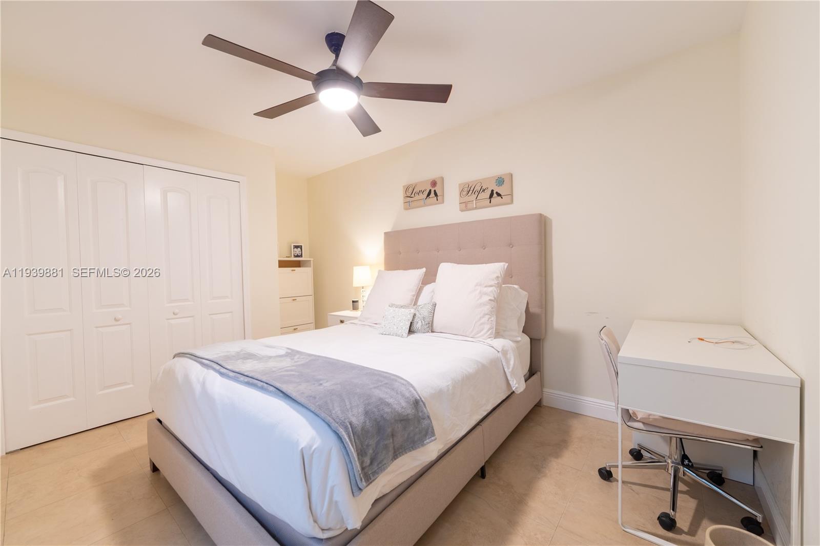 14766 Southwest 81st Street Miami, FL 33193 - Photo 23 of 39 a bedroom with a bed and a chandelier