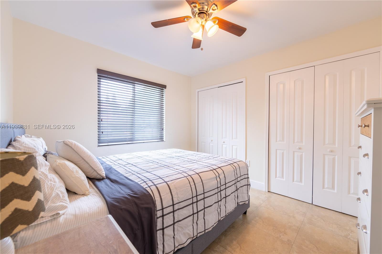14766 Southwest 81st Street Miami, FL 33193 - Photo 28 of 39 a bedroom with a bed and a chandelier