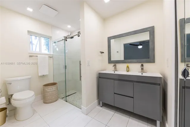a bathroom with a toilet sink and shower