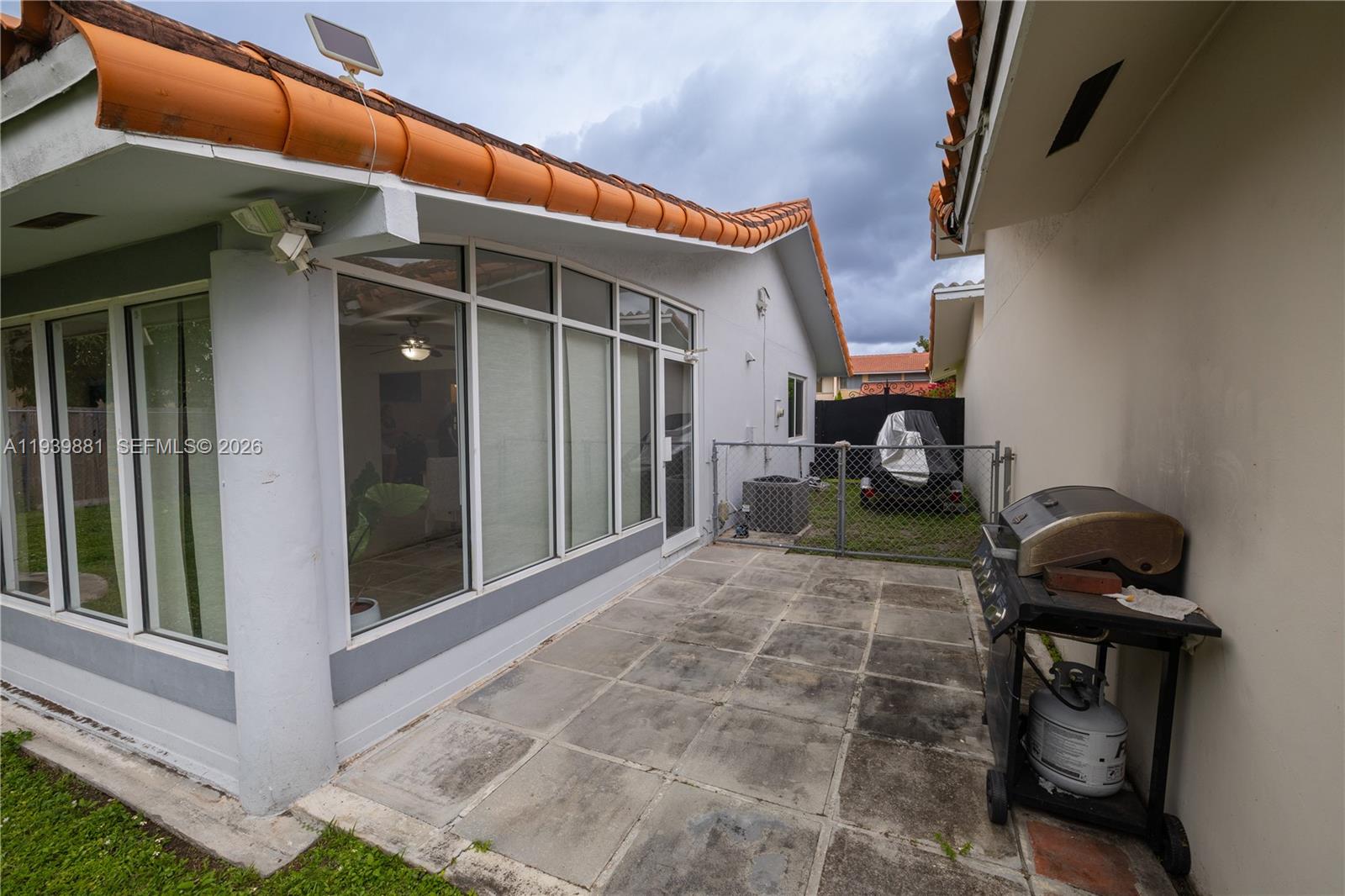 14766 Southwest 81st Street Miami, FL 33193 - Photo 37 of 39 a view of a house with backyard and porch