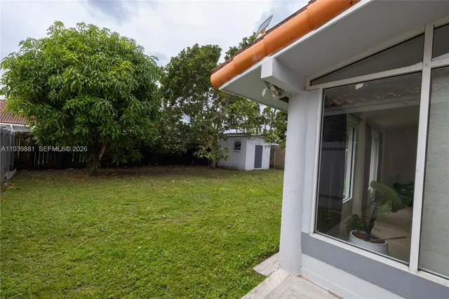 a backyard of a house with lots of green space