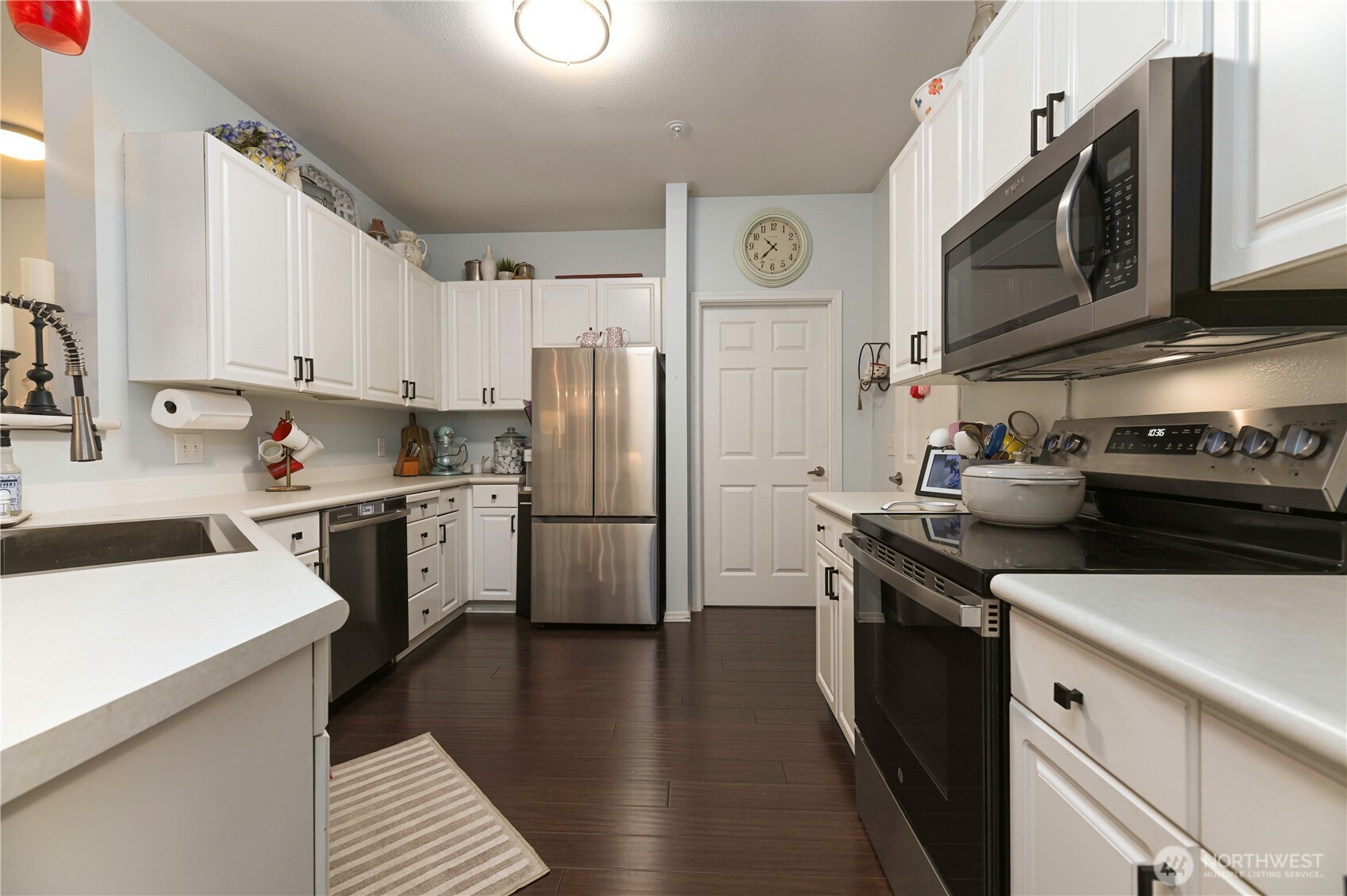 17761 134th Lane Southeast Renton, WA 98058 - Photo 11 of 38 a kitchen with a sink a stove and refrigerator
