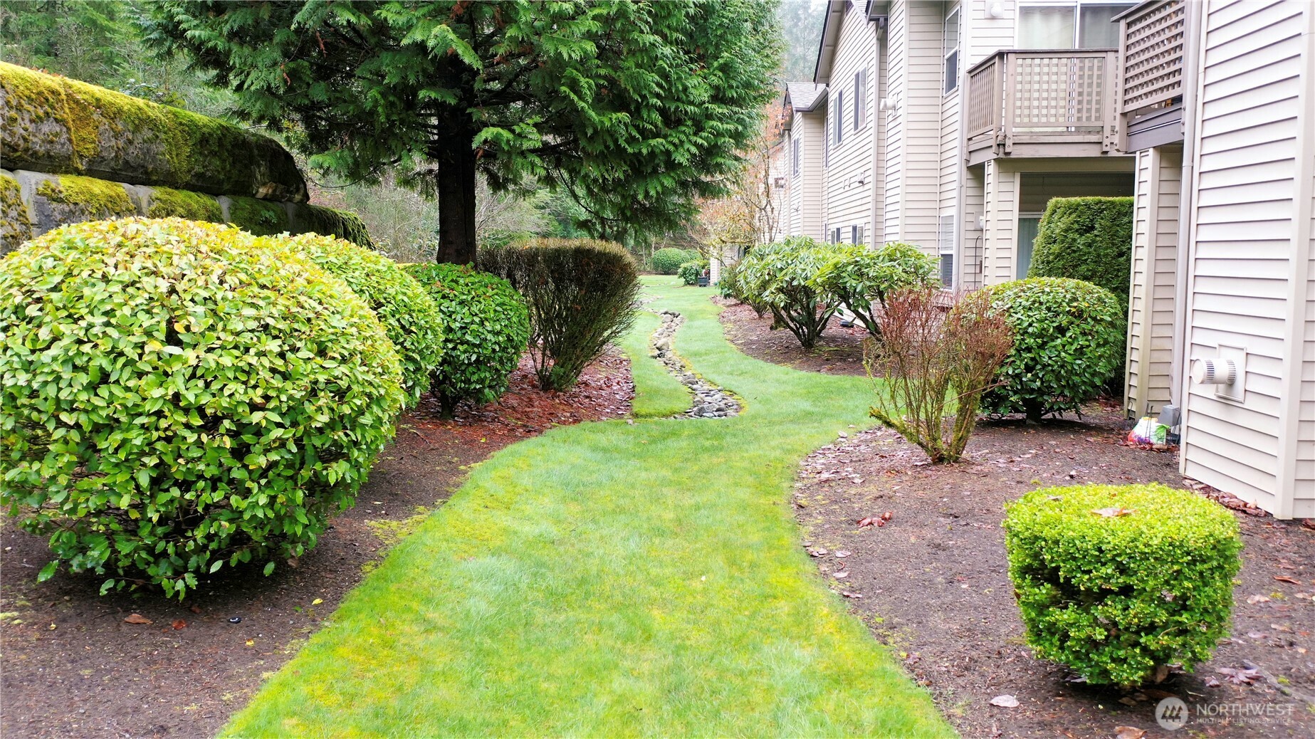 17761 134th Lane Southeast Renton, WA 98058 - Photo 25 of 38 a view of a garden with a fountain