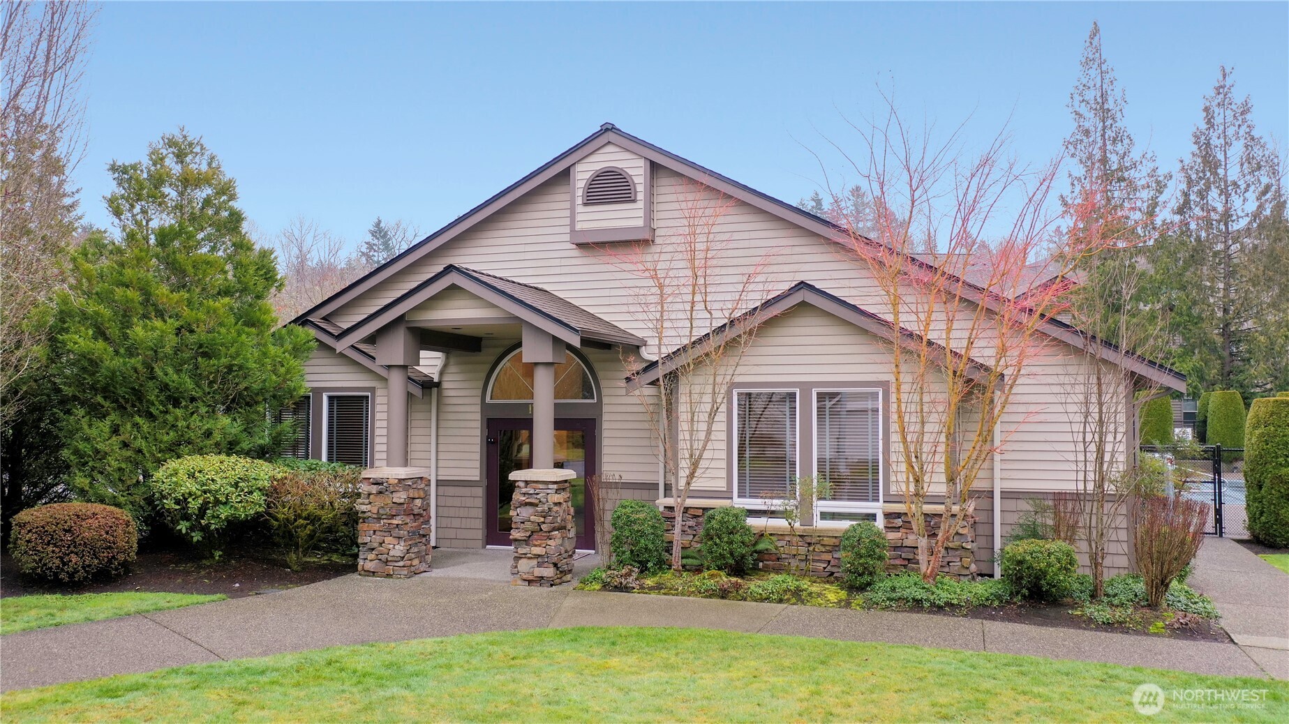 17761 134th Lane Southeast Renton, WA 98058 - Photo 28 of 38 a front view of a house with a yard and potted plants