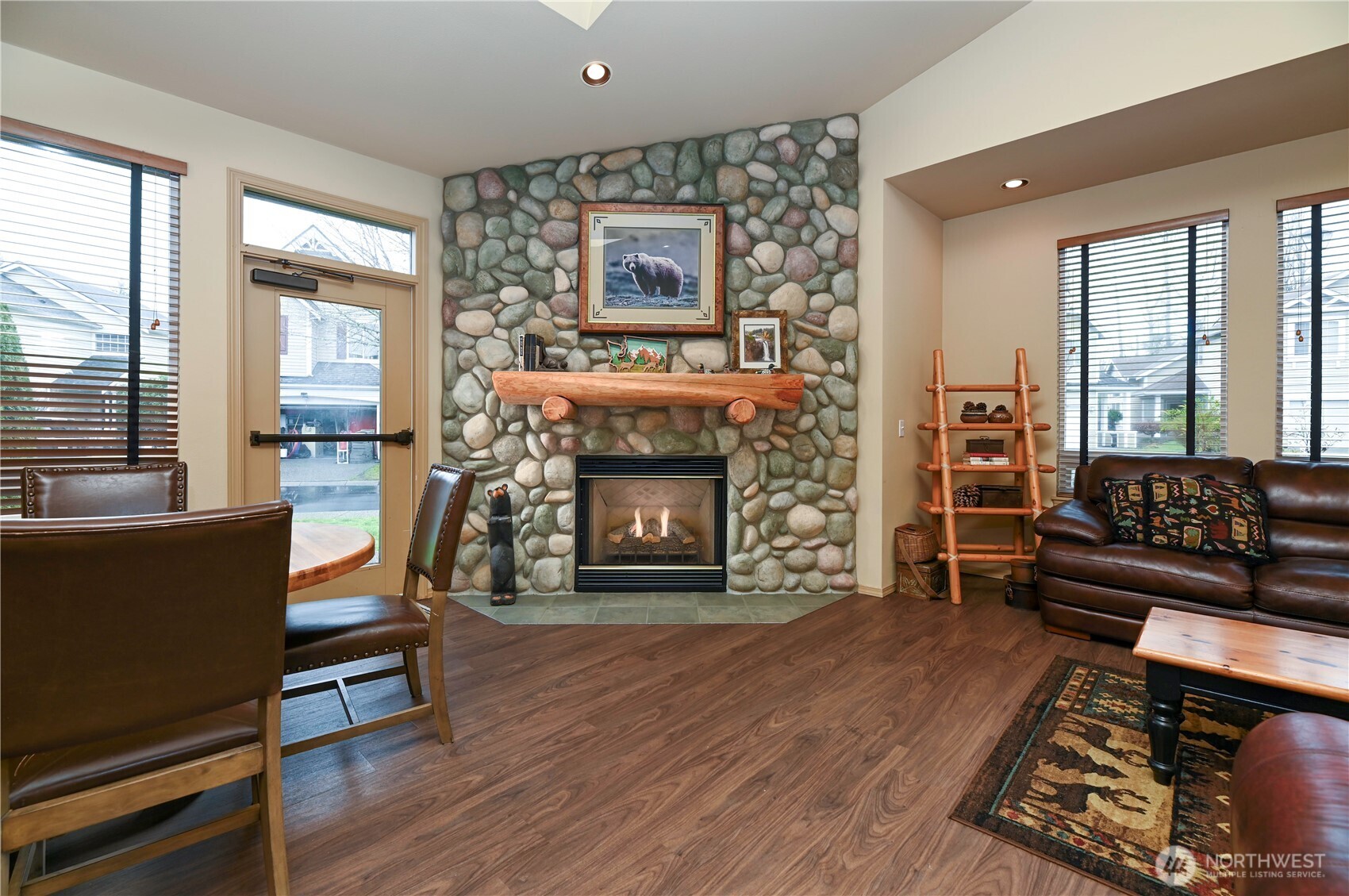 17761 134th Lane Southeast Renton, WA 98058 - Photo 30 of 38 a living room with furniture and a fireplace