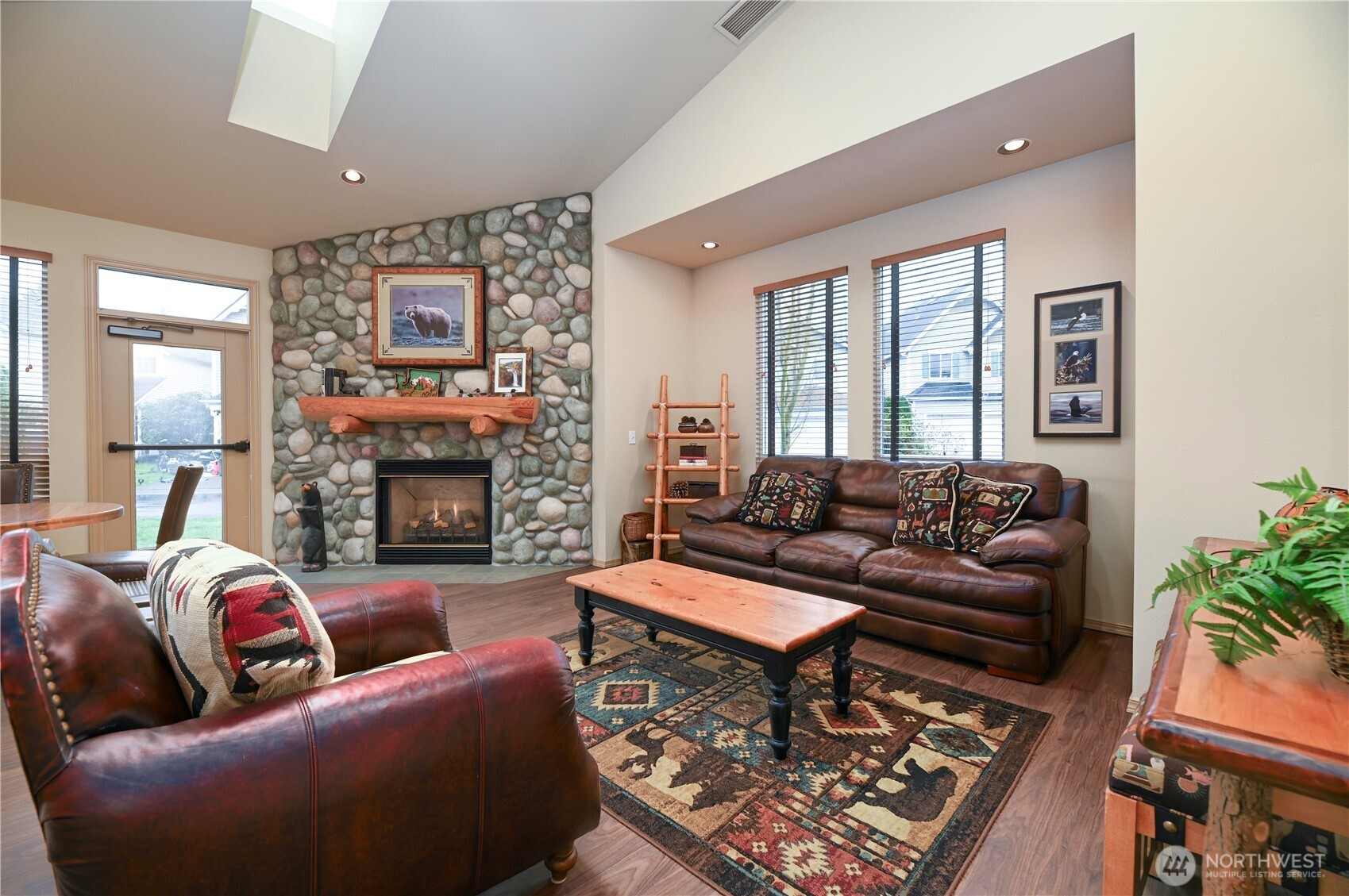 17761 134th Lane Southeast Renton, WA 98058 - Photo 31 of 38 a living room with furniture and a fireplace