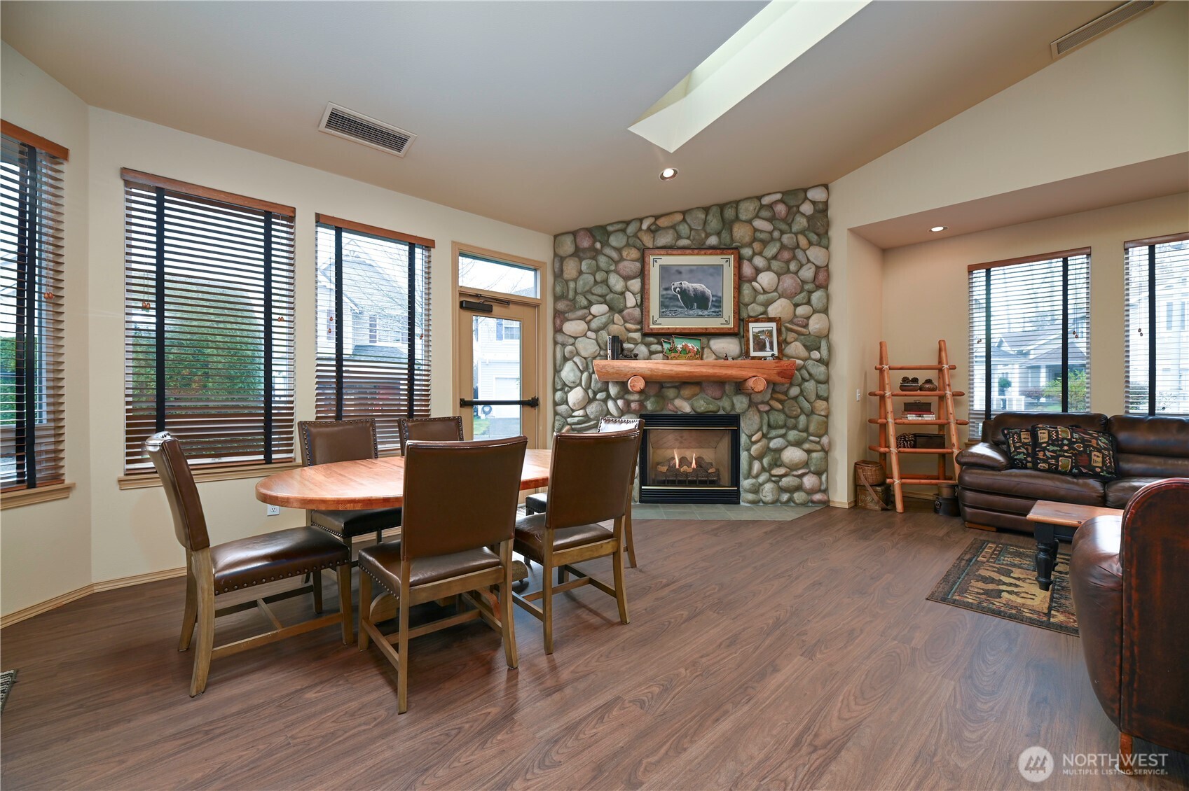 17761 134th Lane Southeast Renton, WA 98058 - Photo 32 of 38 a dining room with furniture and wooden floor