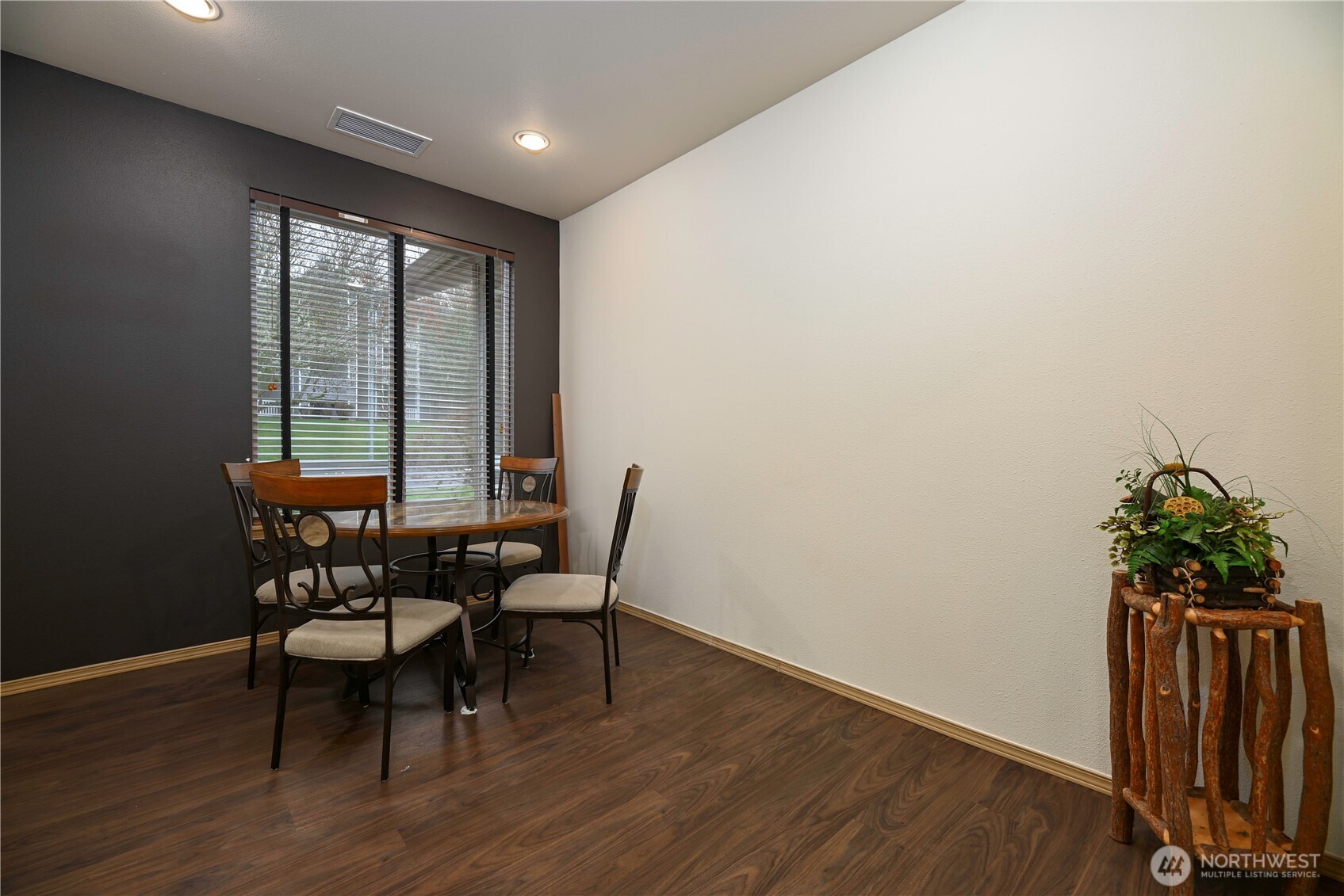 17761 134th Lane Southeast Renton, WA 98058 - Photo 35 of 38 a view of a dining room with furniture window and wooden floor