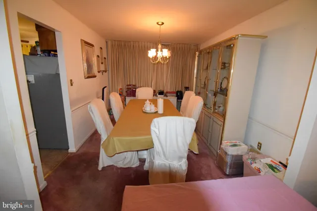 a room with table chair and wooden floor