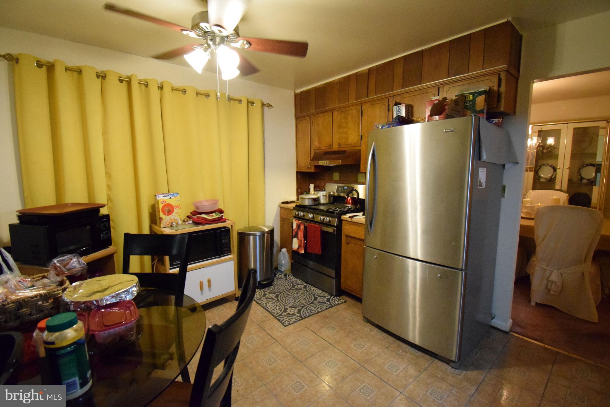4605 Sharon Road Temple Hills, MD 20748 - Photo 15 of 19 a kitchen with stainless steel appliances a refrigerator and a stove top oven